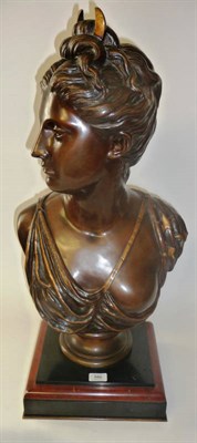 Lot 886 - A Bronze Bust of Diana, head turned to dexter, her hair up with a crescent, wearing loose robes, on