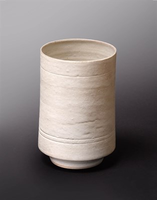 Lot 1069 - Dame Lucie Rie DBE (1902-1995): A Stoneware Cylindrical Vase, covered with an all over white glaze