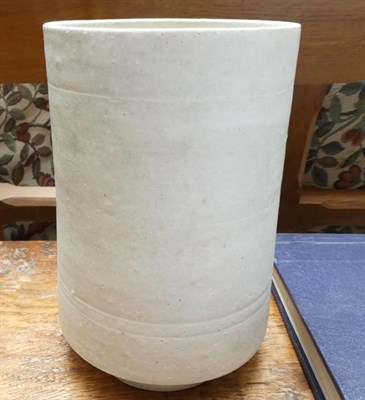 Lot 1069 - Dame Lucie Rie DBE (1902-1995): A Stoneware Cylindrical Vase, covered with an all over white glaze