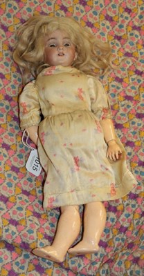 Lot 1015 - German S&H 1249 small bisque socket head doll, with blond hair wearing a floral dress
