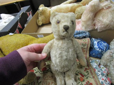 Lot 1028 - Circa 1930s yellow plush jointed teddy bear with boot button eyes, stitched nose and claws; another