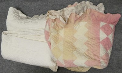 Lot 1041 - Late 19th century cream reversible quilt with pleated frill to the edge, another pink and white...