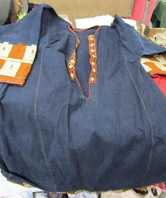 Lot 1042 - Assorted eastern costume including a blue indigo cotton tunic with embroidered hem and cuffs,...