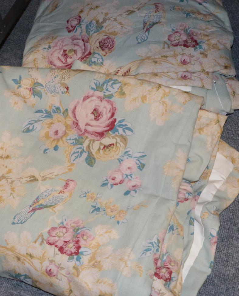 Lot 1054 - Pair of Anna French 'Bird in the Bush' pattern pale blue linen curtains and pelmet, lined and...
