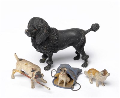 Lot 903 - Black Poodle, unmarked, with lion cut, 7.3cm high; and Three Dog Groups, unmarked, comprising...