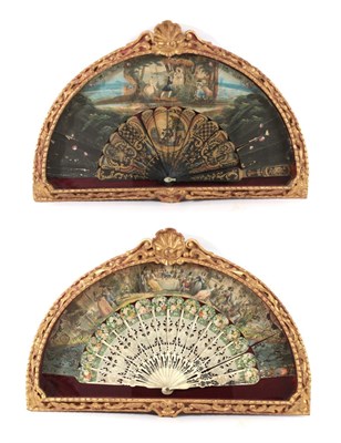 Lot 1078 - An unmatched pair of mid-19th century fans in elaborate shaped and gilded fan cases, both circa...