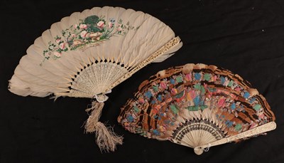 Lot 1091 - Two 19th century Chinese feather fans, comprising a fan with deeply carved ivory guards,...