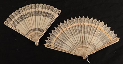 Lot 1092 - Two early 19th European brisé fans, both with slender guards, both carved and pierced in quite...