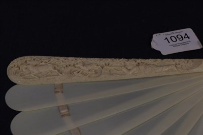 Lot 1094 - A Good Circa 1880's Carved Ivory Brisé Fan, the upper guard deeply carved with a very finely...