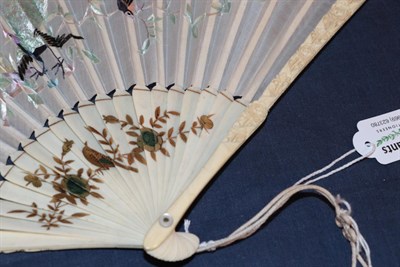 Lot 1096 - A small Chinese ivory fan, most likely early 20th century, the guards quite deeply carved with...