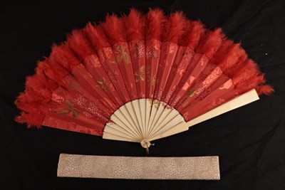 Lot 1098 - A large late 19th century bone fan with a red silk brocade leaf, the fabric woven with floral...