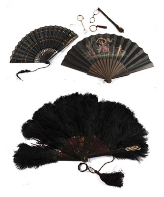 Lot 1100 - Three 19th century fans and optical accessories, to include a black ostrich feather fan mounted...