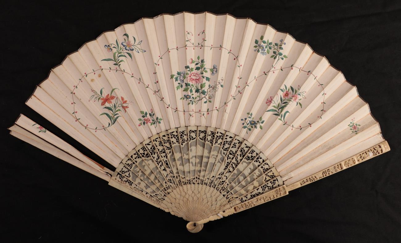 Lot 1109 - An 18th century ivory fan with carved Chinese Export monture, the double leaf delicately...