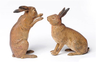 Lot 911 - Two Hares, Franz Bergmann, Austria, one seated on its haunches wiping its snout, vase rebus,...