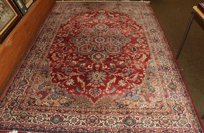 Lot 1191 - A machine made carpet of Oriental design, 290cm by 201cm