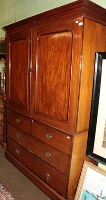 Lot 1205 - A late Victorian mahogany linen press, the upper section converted to hanging space, 135cm wide