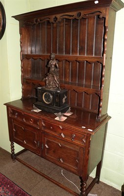 Lot 1208 - A 1920's carved oak Welsh dresser, 120cm wide