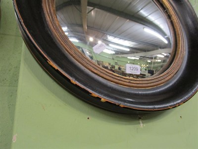 Lot 1209 - A pair of circular ebonised convex mirrors