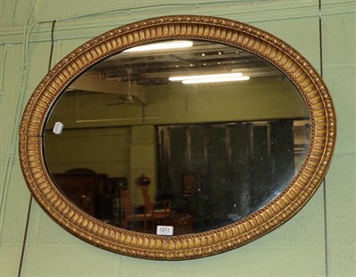 Lot 1211 - A gilt wood oval mirror