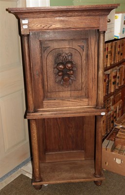 Lot 1220 - A 19th century Danish oak cabinet on stand, integral cornice, single door with carved fruit...