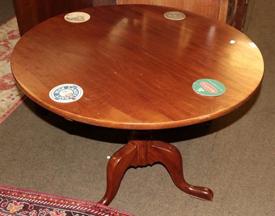 Lot 1234 - A George III style tripod table (2)