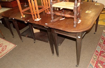 Lot 1238 - A Regency style mahogany D end dining table, composed of two D end tables, a central gateleg...