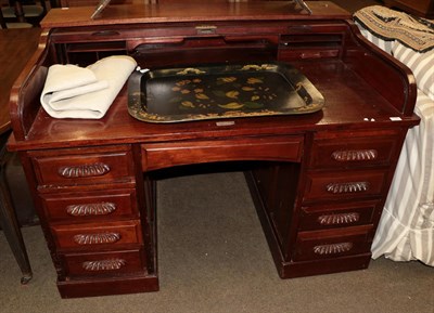 Lot 1243 - An early 20th century mahogany roll top desk with brass plaque impressed ''Feige Desk Company,...