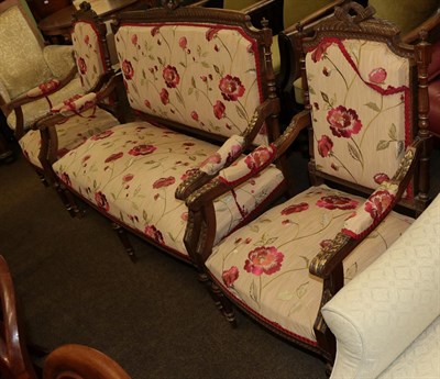 Lot 1265 - A late 19th century walnut framed three piece suite recovered in floral fabric