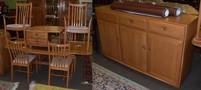 Lot 1272 - An Ercol suite comprising: a dining table; six chairs (4+2); and a sideboard