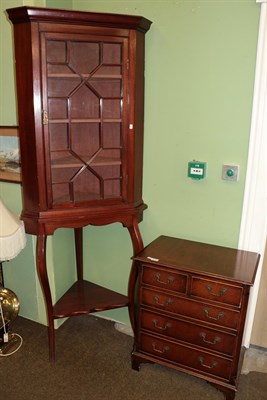 Lot 1288 - A reproduction mahogany and crossbanded five drawer chest and an Edwardian mahogany glazed...