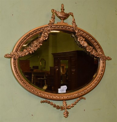 Lot 1291 - An oval bevelled wall mirror in the Adams style, 56cm by 60cm