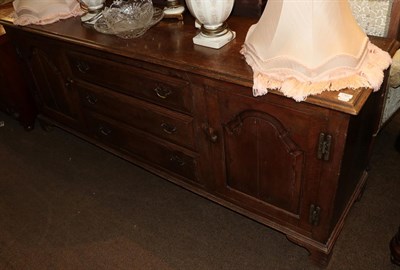 Lot 1302 - An early 20th century oak dresser