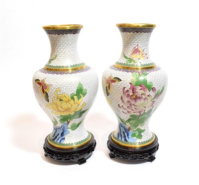 Lot 13 - A pair of Chinese cloisonne baluster vases, floral decoration, wooden stands, boxed, 36cm high