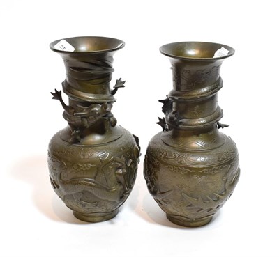 Lot 14 - Pair of Chinese bronze vases with dragon design, 25cm high