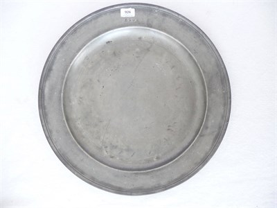 Lot 926 - A Pewter Circular Dish, circa 1700, with reeded rim, four touch marks, 52cm diameter  See Cotterell