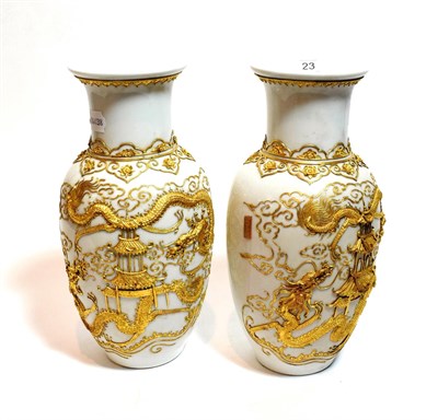 Lot 23 - A pair of 20th century Chinese porcelain baluster vases, applied with gilt metal dragon and...