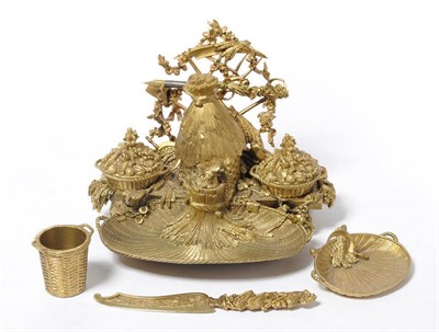 Lot 928 - A French Gilt Metal Inkstand, late 19th century, the pen stand with agricultural implements and...