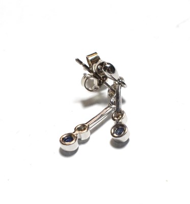 Lot 49 - A pair of 18 carat white gold sapphire and diamond drop earrings, a knife edge bar with a round...