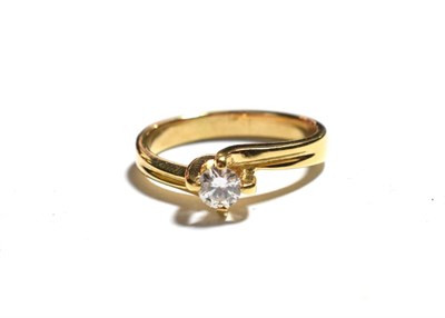 Lot 57 - A diamond solitaire ring, the round brilliant cut diamond in a yellow claw setting, on a...