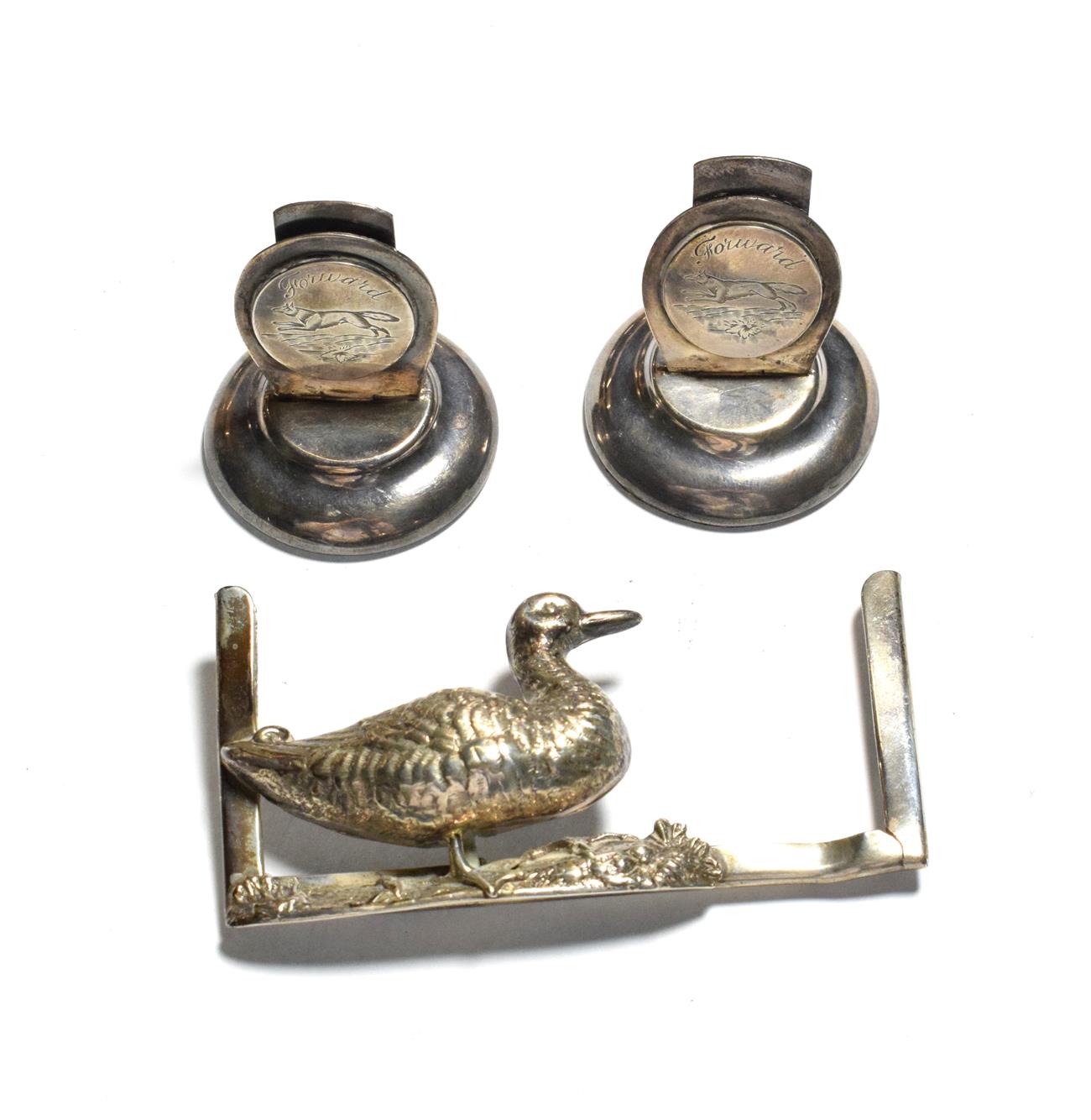 Lot 70 - A pair of George V silver place-card holders, maker's mark F&H Ltd, London, 1934, each on...