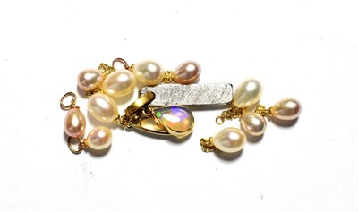 Lot 86 - Eleven cultured pearl charms/pendants, unmarked; together with a 9 carat gold opal pendant,...