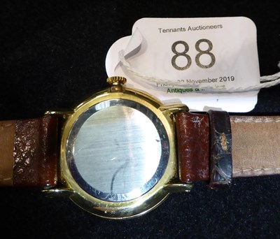 Lot 88 - A gold plated and steel wristwatch, signed Omega, model, De Ville, on leather strap