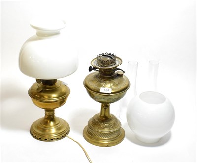 Lot 133 - Two brass oil lamps with shades and chimneys