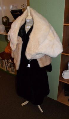 Lot 142 - Black fur coat labelled Maxwell Croft, London, together with a modern corset laced mannequin (2)