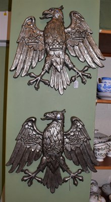 Lot 154 - A pair of cast alloy plaques as heraldic eagles, 49cm high