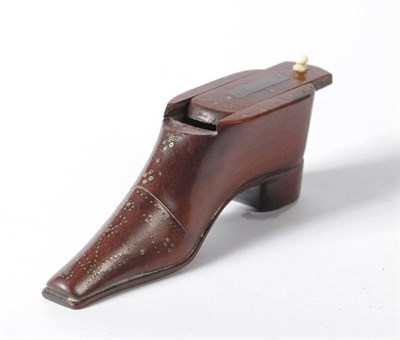 Lot 940 - A Mahogany Snuff Box in the Form of a Shoe, 19th century, the sliding cover with ivory knop...