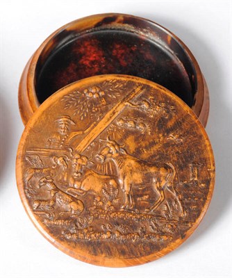 Lot 941 - A French Burr Wood Circular Snuff Box and Cover, 19th century, the cover pressed with a scene...