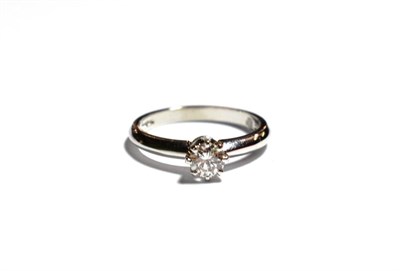Lot 173 - A platinum diamond solitaire ring, a round brilliant cut diamond in a claw setting, on a...