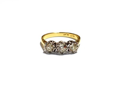 Lot 176 - A diamond three stone ring, stamped '18CT' and 'PLAT', finger size M1/2
