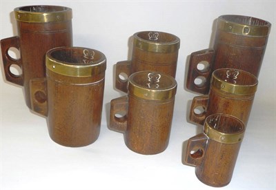 Lot 943 - A Graduated Set of Seven Victorian Brass Bound Beech Seed Measures, of cylindrical form with...